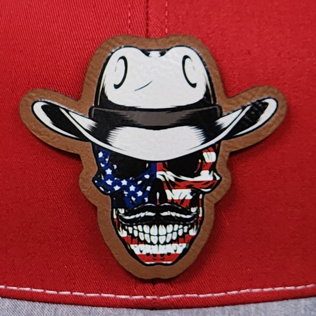 Patriotic cowboy skull leatherette hat patch with American flag design, perfect for Independence Day and cowboy-themed fashion.