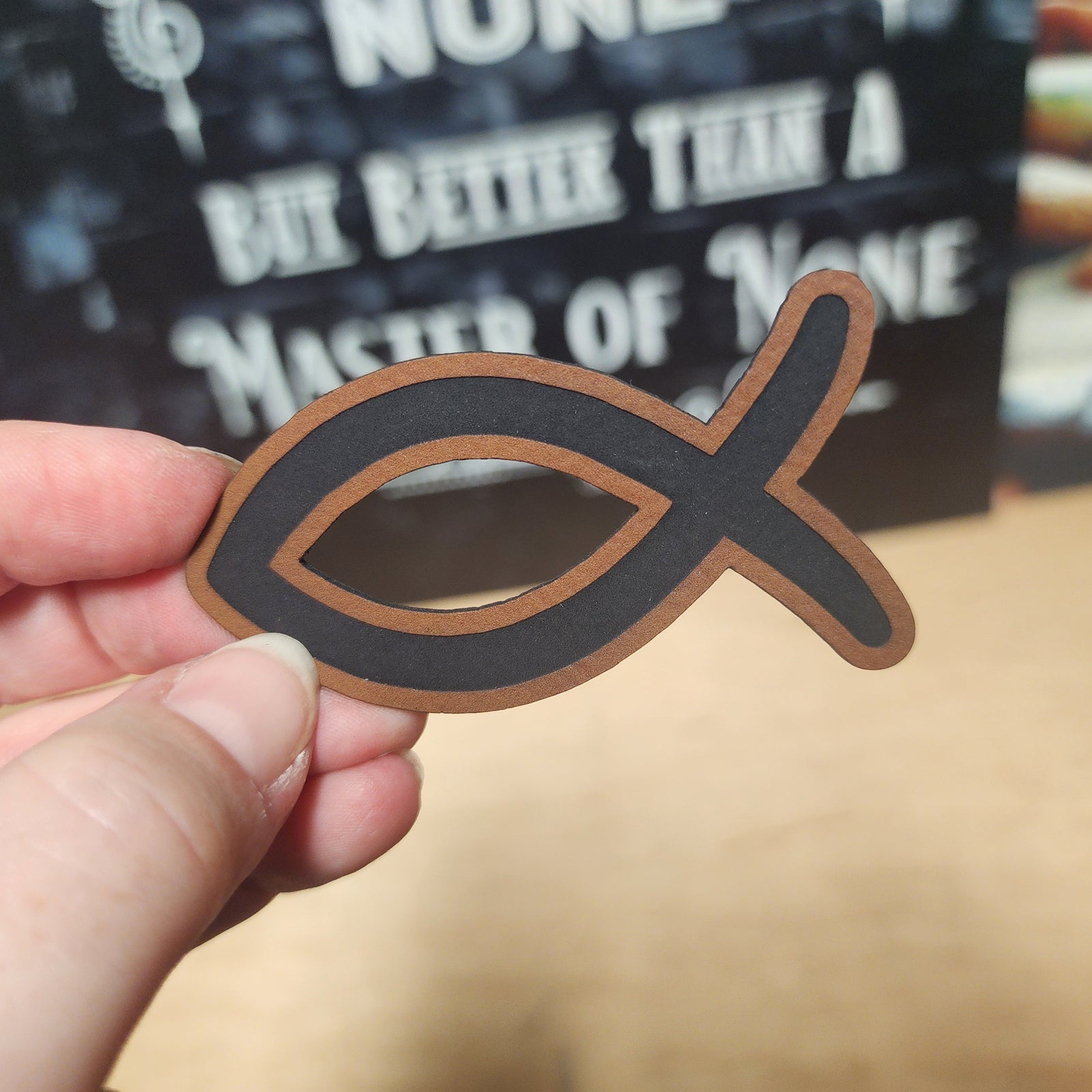 Leatherette fish symbol hat patch, perfect for religious headwear and faith-based fashion accessories.