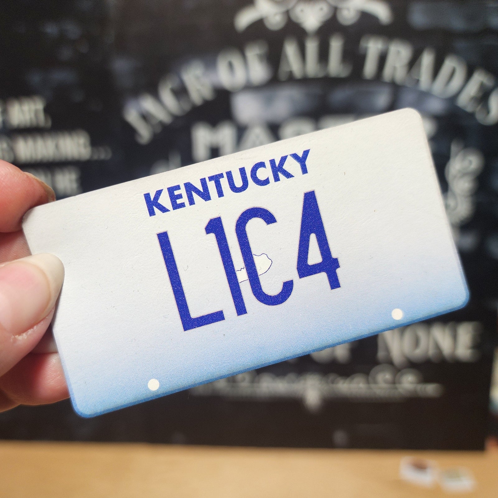 Kentucky license plate leatherette patch, ideal for hats, collectors, and personalized gear.