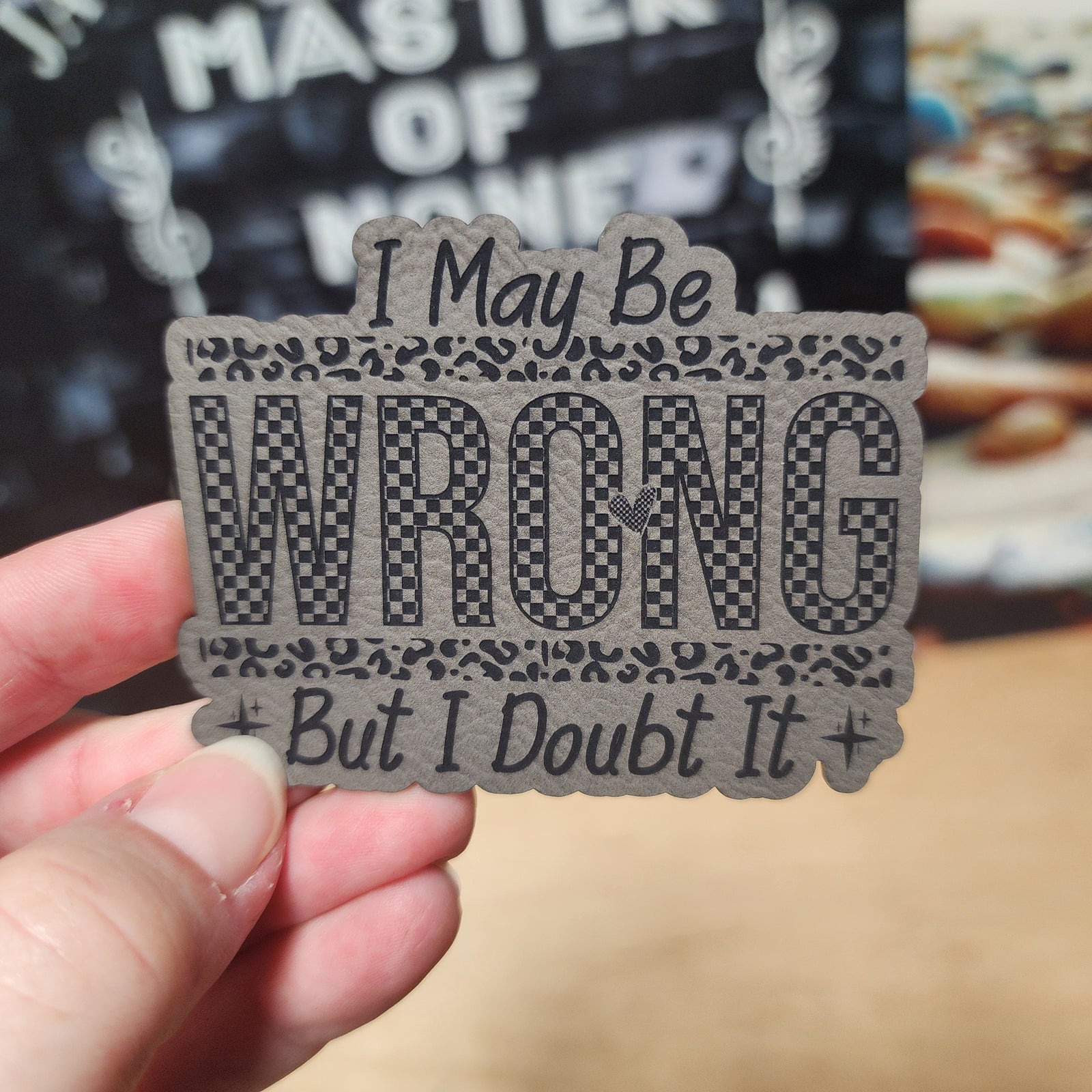 Funny leatherette hat patch that says 'I May Be WRONG But I Doubt It', perfect for humor lovers.