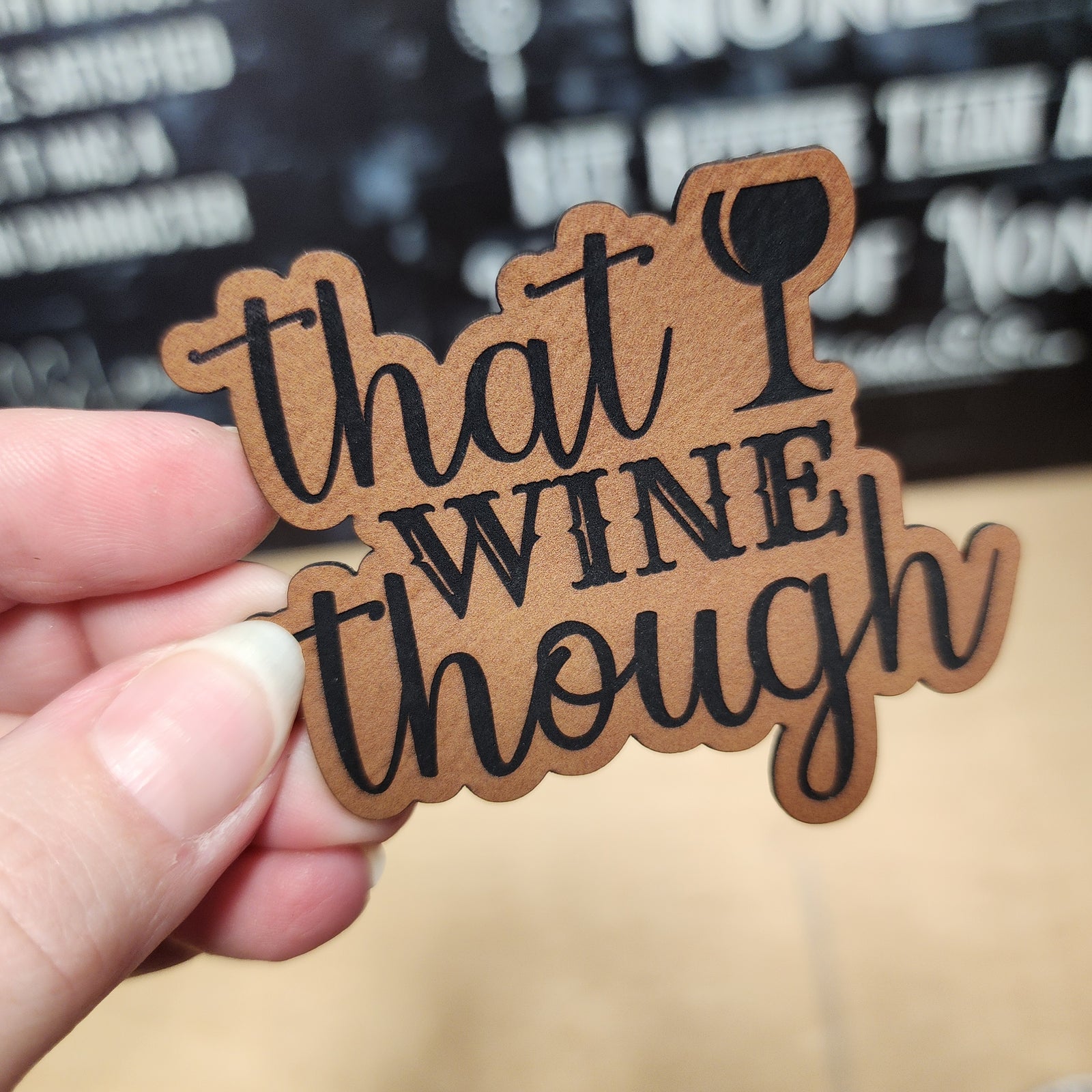 Humorous leatherette hat patch saying 'that I WINE though', perfect for wine lovers and fun gifts.