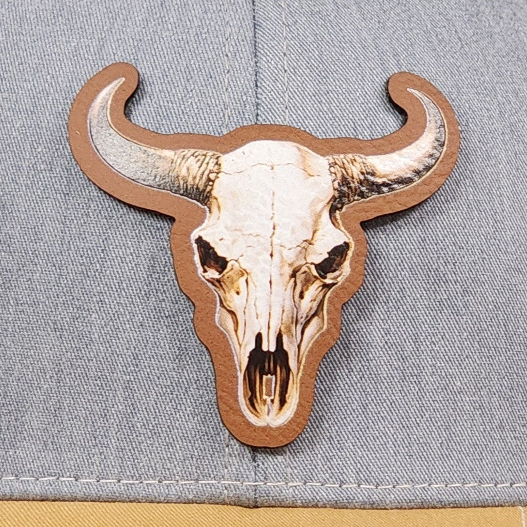 Cow skull leatherette hat patch for Western apparel, cowboy hats, and ranch wear enthusiasts.