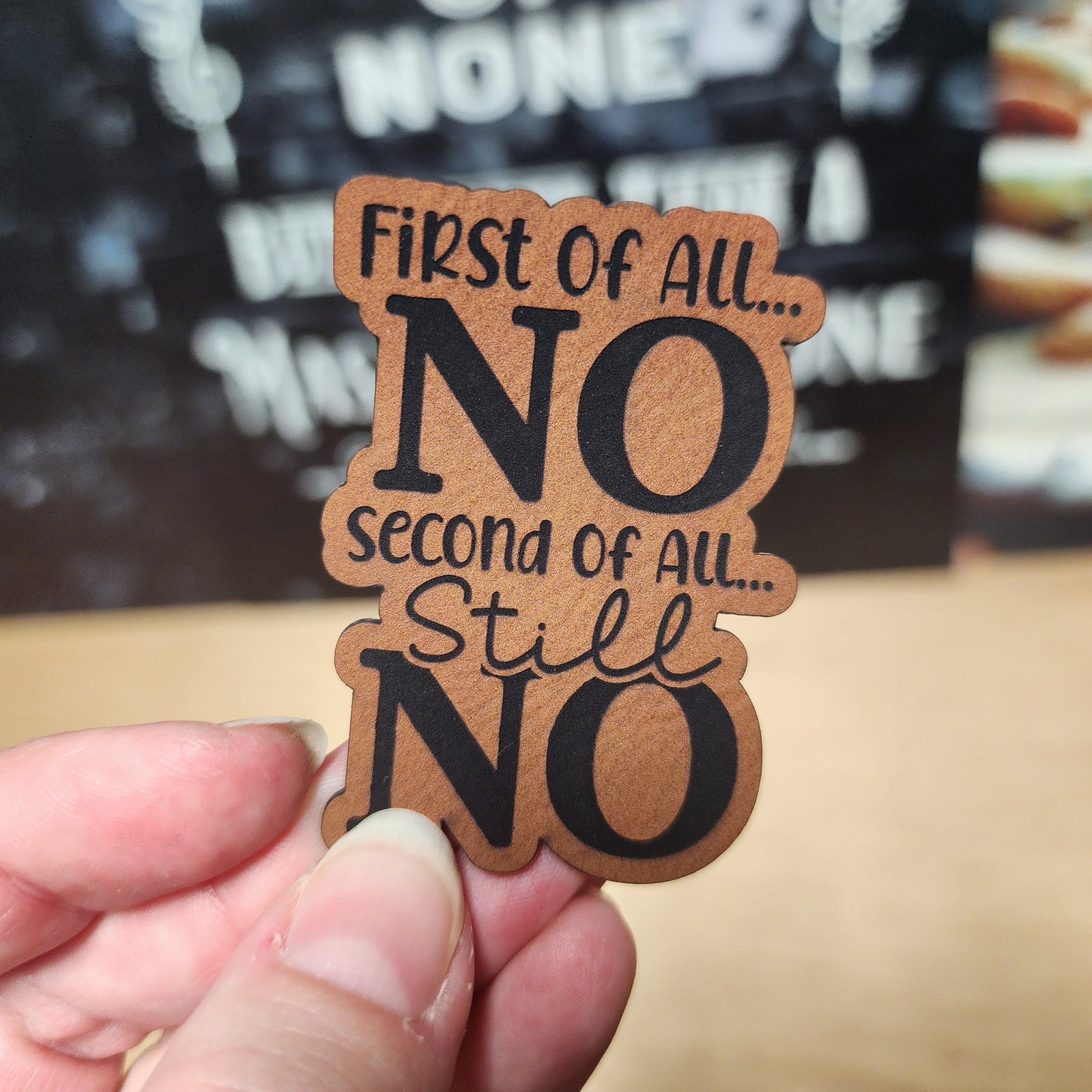 Humorous leatherette hat patch saying 'First of All... NO, Second of All... Still NO' for casual wear.