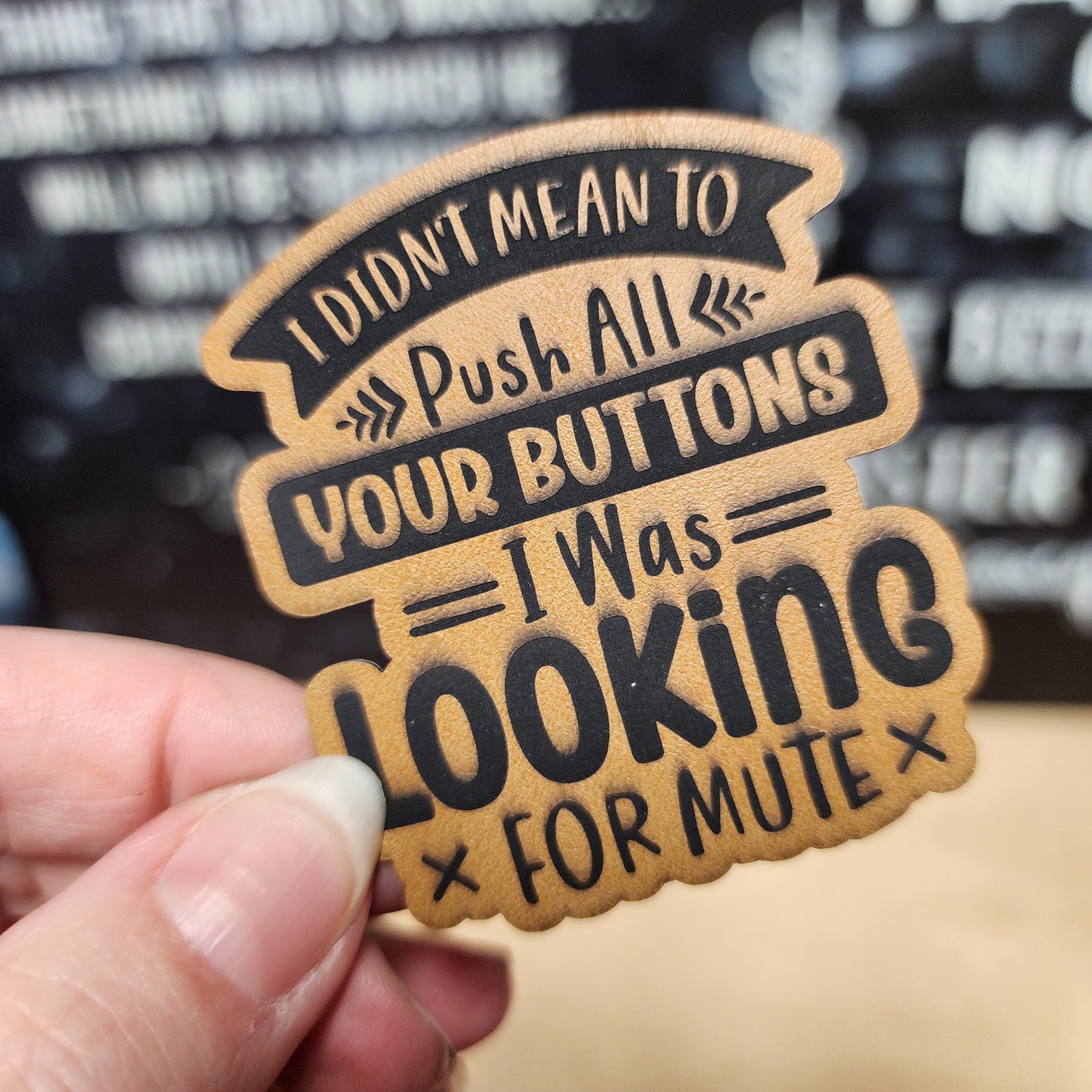 Funny leatherette hat patch saying 'I Didn't Mean to Push All Your Buttons, I Was Looking for Mute' for humorous apparel.