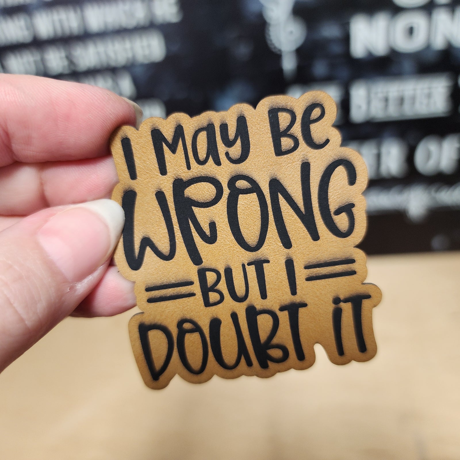 Funny leatherette hat patch saying 'I may be wrong but I doubt it', perfect for quirky hat lovers.