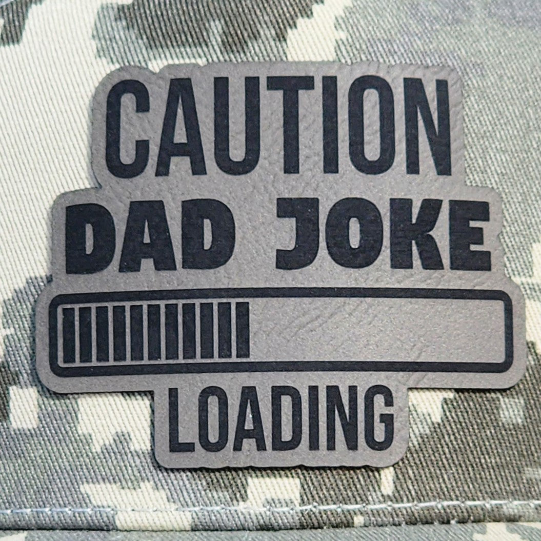 Caution Dad Joke Loading leatherette hat patch for humorous dad gifts and quirky fashion accessories.