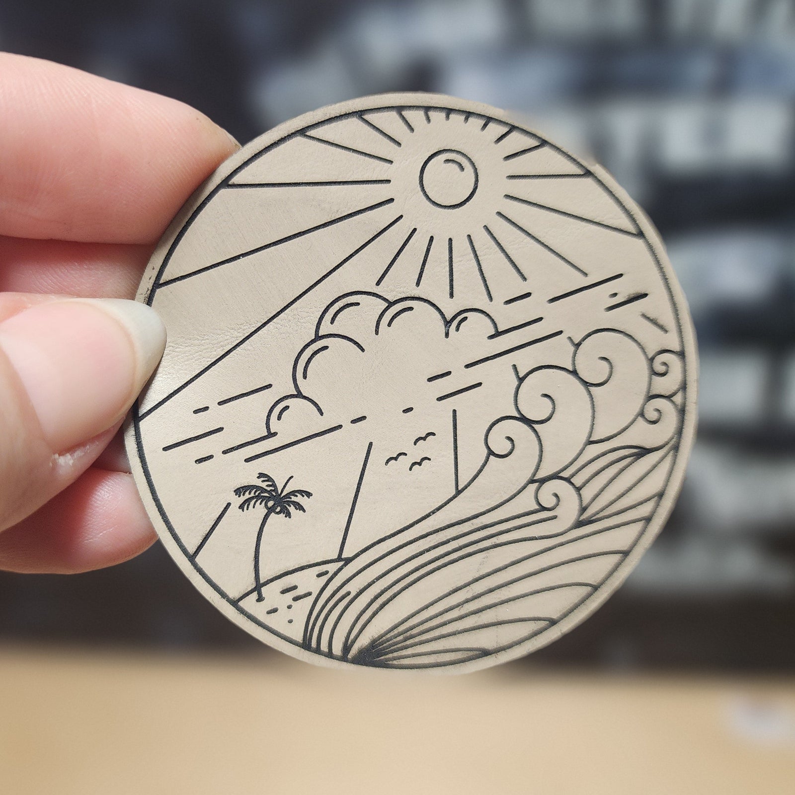 Beach sunset leatherette hat patch featuring waves, sun, and palm tree, perfect for summer adventures.