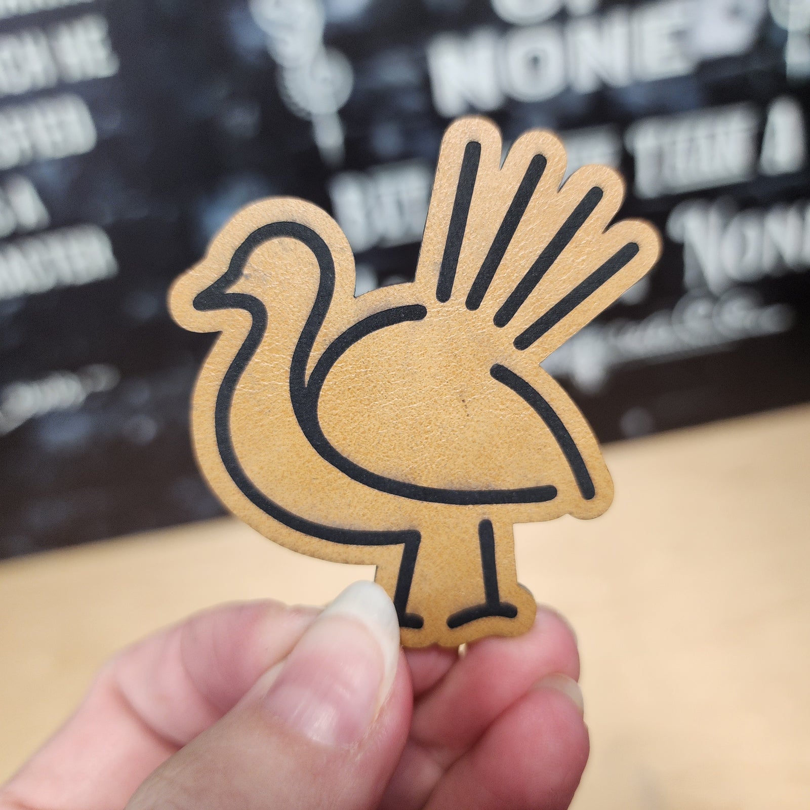 Leatherette bird hat patch, ideal for unique hats and DIY projects, featuring a stylized bird design.