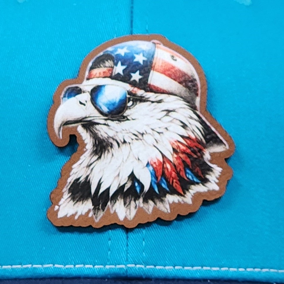 Patriotic eagle leatherette hat patch with sunglasses and American flag design for vintage style hats.