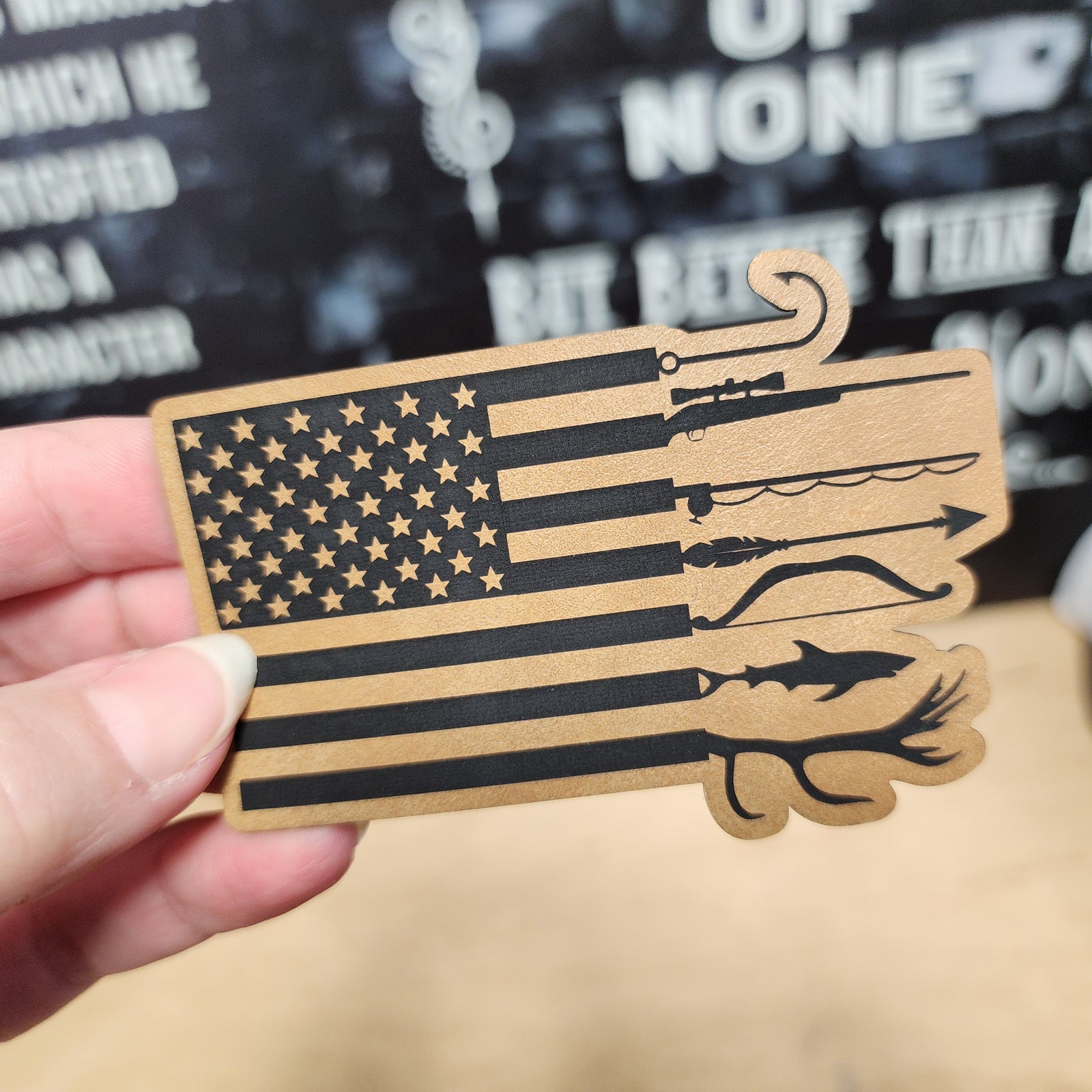 American flag leatherette hat patch with fishing and hunting motifs for outdoor enthusiasts and patriotic apparel.